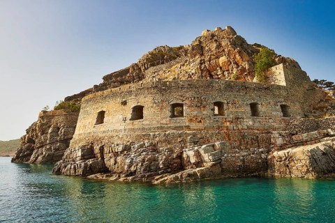 Historic rock fortress on the edge of the sea under a clear blue sky, Venetian sea fortress, Leper