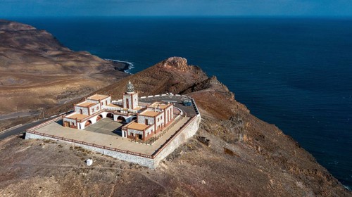 Bird's eye view of aerial view of building complex of lighthouse Faro de la Entallada from 50s year
