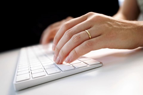 Hands typing on a keyboard in Berlin, 09/08/2024