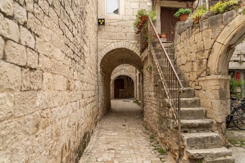 Narrow alley in the old town centre of Trogir, Croatia, Europe
