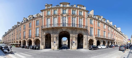 Impressive building with arcades at a crossroads, Paris