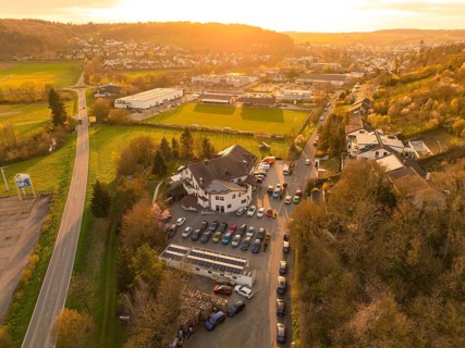 Urban landscape with an accentuated sunset over the fields and buildings, Europäischer Hof,