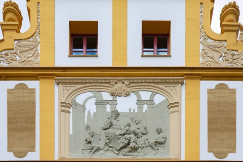 Relief with teacher and pupils on the façade of the Luitpold Primary School, built in 1901 in Art