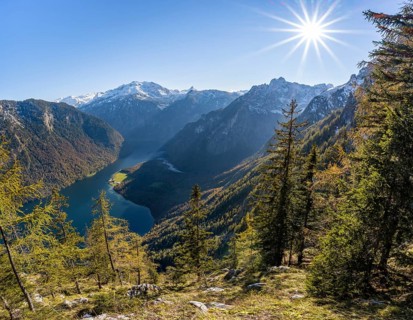 Panoramic view of the Königssee from the Archenkanzel viewpoint, autumnal forest and snow-capped