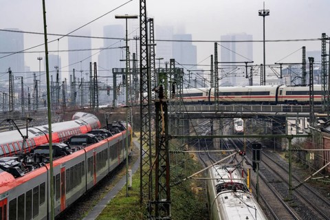 Railway tracks with regional and long-distance trains, ICE, after freezing rain, in front of