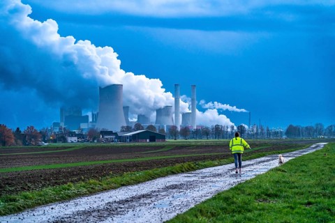Field path, woman walking her dog, lignite-fired power plant, RWE Power AG Niederaußem power plant,