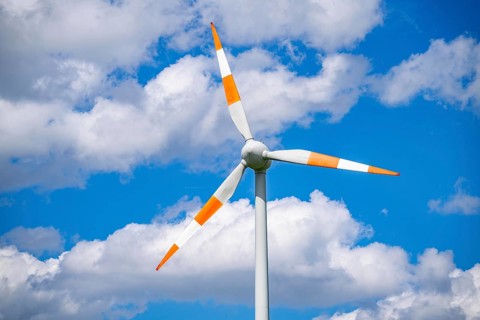 Wind turbine, wind energy plant from the manufacturer Enercon, blue sky with many white clouds,