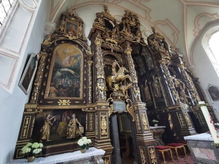 Altar wall, votive pictures, votive tablets on the walls of the Chapel of Grace inside the church,