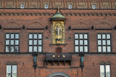 Brick façade with gilded sculpture of Bishop Absalon, Town Hall in the National Romantic style by