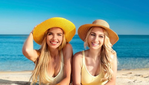 Two young woman on the beach in the Caribbean, Studio