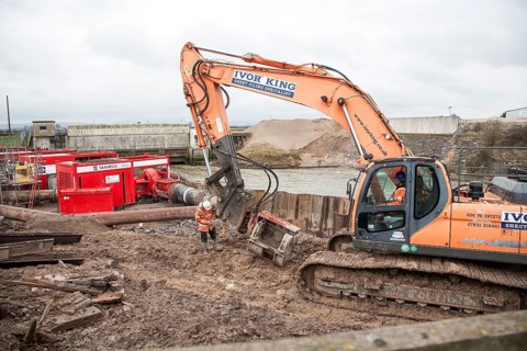Engineering work on flood defences on the King's Sedgemoor Drain river at Dunball, near Bridgwater,
