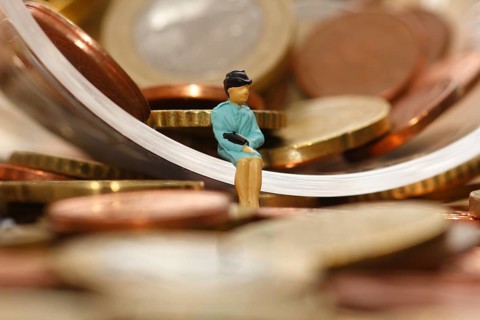 Miniature woman with euro coins, North Rhine-Westphalia, Germany, Europe