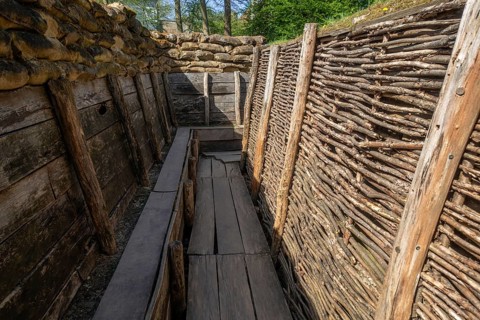 German WW1 trench showing fire step, wooden duckboards and woven wickerwork branches at the