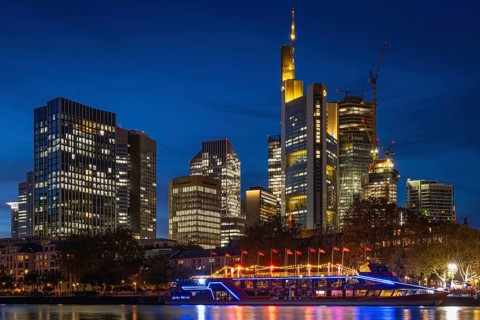 The Kansas City Chiefs' NFL boat is anchored on the River Main in front of Frankfurt's banking