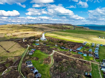 Portland Bird Observatory from a drone, Bill Lighthouse, Portland Bill, Isle of Portland, Dorset,
