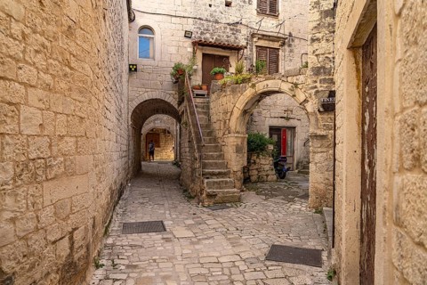 Narrow alley in the old town centre of Trogir, Croatia, Europe