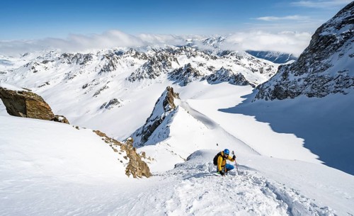 Mountaineer with ice axe and crampons, ascent through steep snowfield to Piz Kesch or Piz d'Es-cha