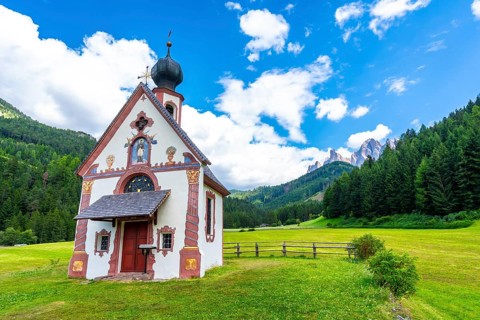 Scenic view of the st. Magdalena church with the odle mountains in the background, a popular