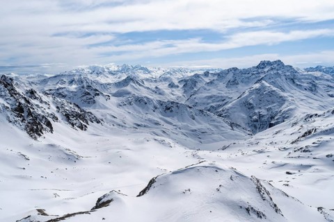 Mountain panorama with view of peaks of the Bernina group, view from Piz Grialetsch in winter,