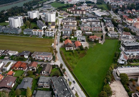 Drone image, grassland between built-up residential area, residential buildings and high-rise