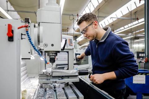 Remscheid, North Rhine-Westphalia, Germany - Trainees in metal professions, here at a machine tool,