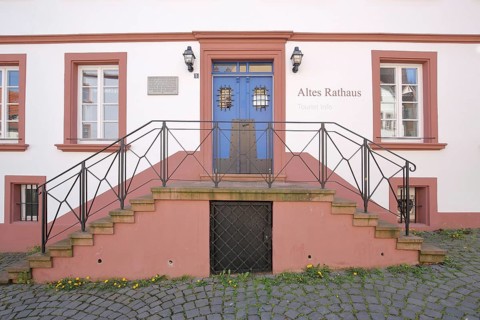 Entrance with staircase to the historic Old Town Hall built in 1717, inscription, red building,