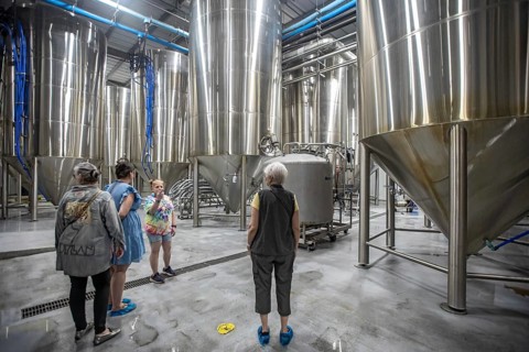 Covington, Louisiana - The Abita Brewing Company's craft beer brewery. A tour guide explains the