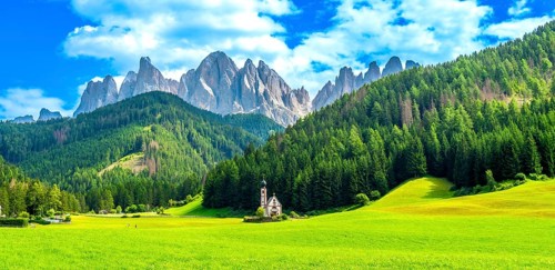 Scenic landscape featuring the st. Magdalena church nestled in a vibrant green valley with the