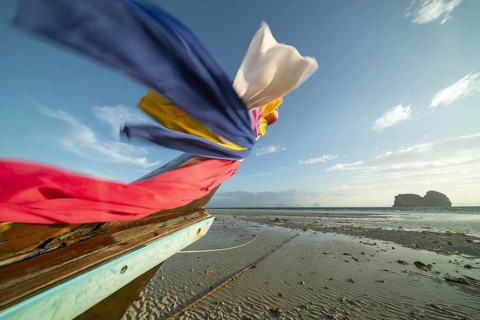 Longtail boat on the beach, at low tide, Koh Ngai Island, Andaman Sea, Satun Province, Southern