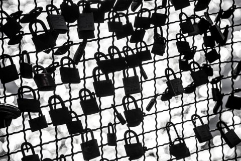 Padlocks, so-called love locks on a fence, vantage point in Wesel am Rhein, North Rhine-Westphalia,