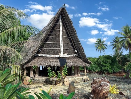 Traditional historical meeting house for men Tribal Chief Men Men's House between palm trees, in