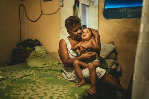 Lucilla Iriarte (68) with her grandson Alaín (2) in Petare, Caracas, Venezuela, South America