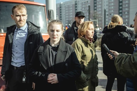 Bodyguards and Beatrix von Storch (in the background) at the final rally of Beatrix von Storch and