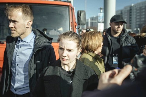 Bodyguards and Beatrix von Storch (in the background) at the final rally of Beatrix von Storch and