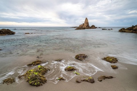 Rocky coast, rocks washed by water, Cabo de Gata-Nijar Natural Park, Almeria, Andalusia, Spain,
