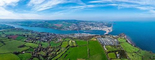 Panorama of Coast View Holiday Park, Farms and Fields over River Teign from a drone, Teignmouth,