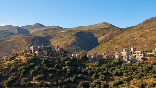Historic village on sunlit hills, Vathia, residential tower village, Mani peninsula, Peloponnese,