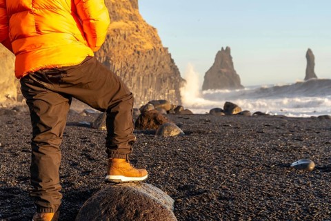 Unrecognizable person on the beautiful Reynisfjara Black Sand Beach in Iceland in winter