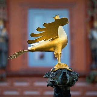 Gilded imperial eagle as a fountain eagle on the market fountain in front of the Kaiserworth