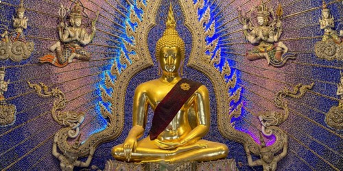 Golden Buddha statue with tunic, Bhumispara-mudra, Buddha Gautama at the moment of enlightenment,