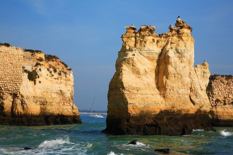Praia do Pinhao, Lagos, Algarve, Portugal, Majestic coastal landscape with steep cliffs and a