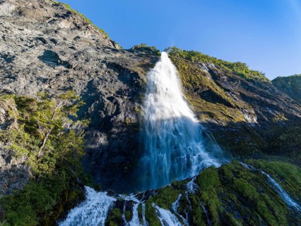 Waterfall at the Bay of Last Hope, fjords and mountains, Puerto Natales, Patagonia, Chile, South