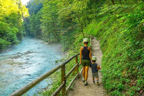 Tourists enjoying a scenic walk through the beautiful vintgar gorge near bled, slovenia, on a