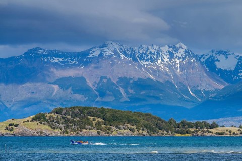 Motorboat with tourists travelling fast on the lake Lago General Carrera, also Lago Chelenko,
