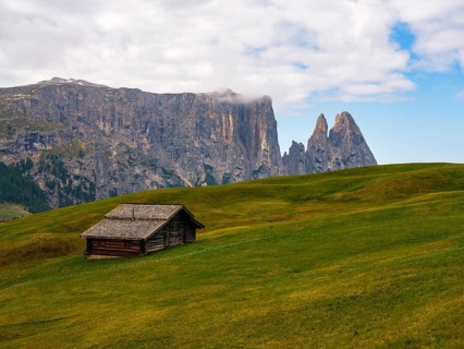 Alpine hut in front of the Sciliar, Punta Santner, Dolomites, Alpe di Siusi, South Tyrol, Italy,