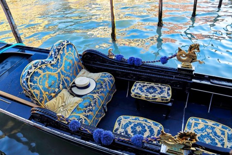 Luxury Gondola waiting for tourists near Rialto Bridge in Venice