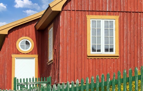 Typical architecture of Greenland capital Nuuk with colored houses located near fjords and icebergs