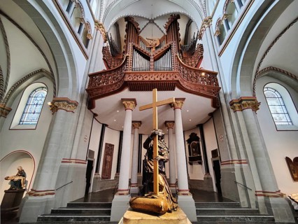 Interior view of Bonn Minster, bronze statue of St Helena with Klais organ in the west apse, Bonn,