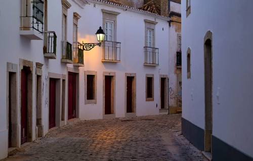 Winding alley, Rua Monsenhor Boto, alleyway lamp, old town, Faro, dusk, evening light, Algarve,