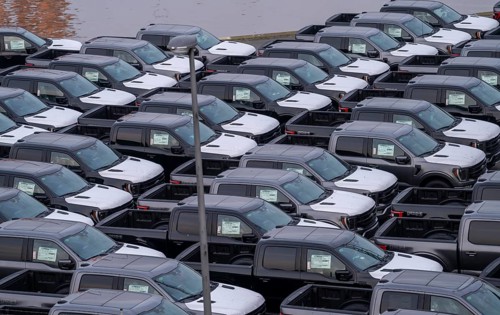 Ford FX4 pickup trucks on stockpile, in the overseas harbour of Bremerhaven, after import from the